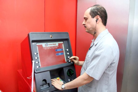 Doctor Sam Taraporevala, Director X R C V C using Talking ATM at B P A, Ahmedabad